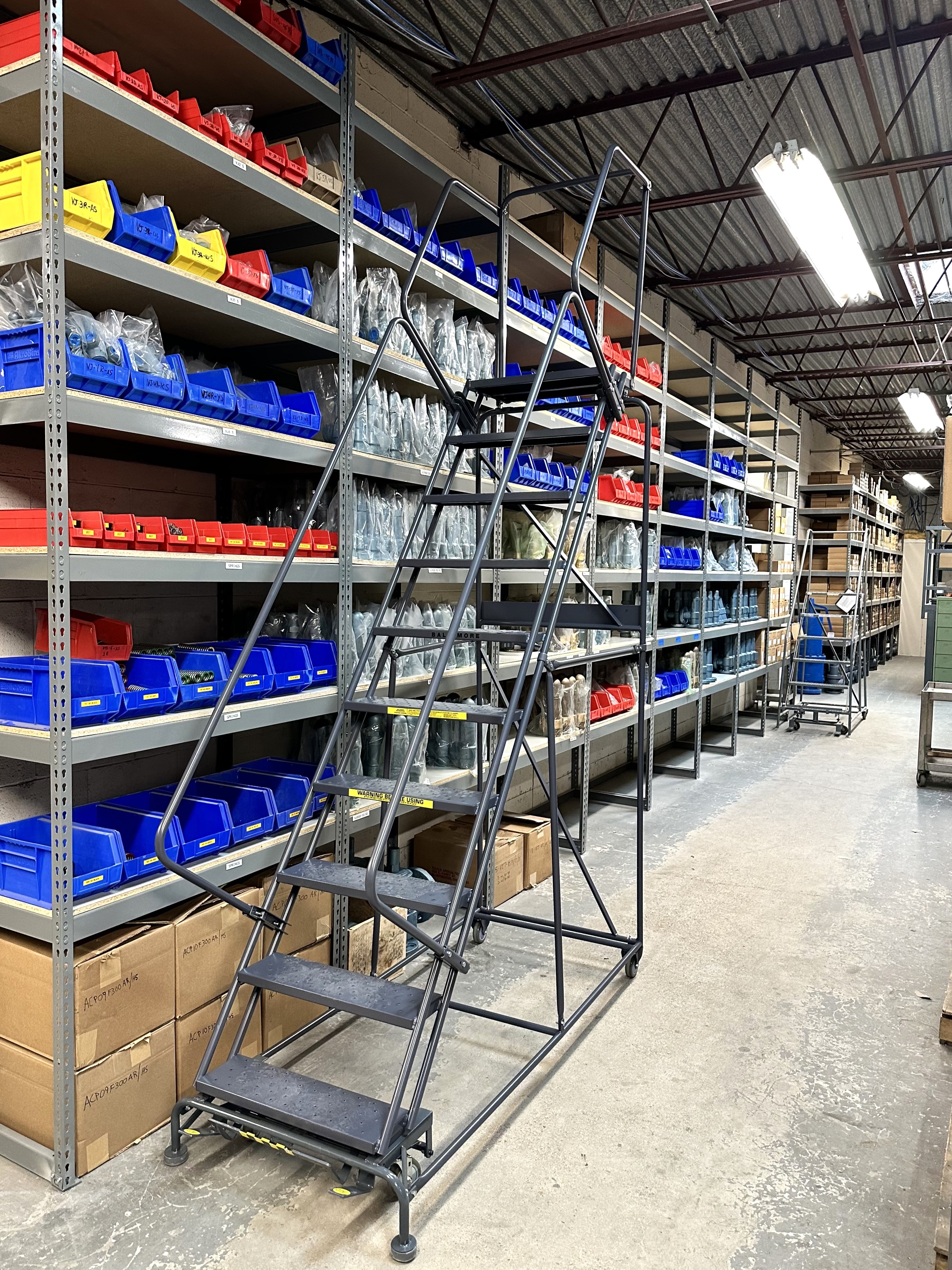 Rivet Shelving in Warehouse with ladder to reach higher shelf levels